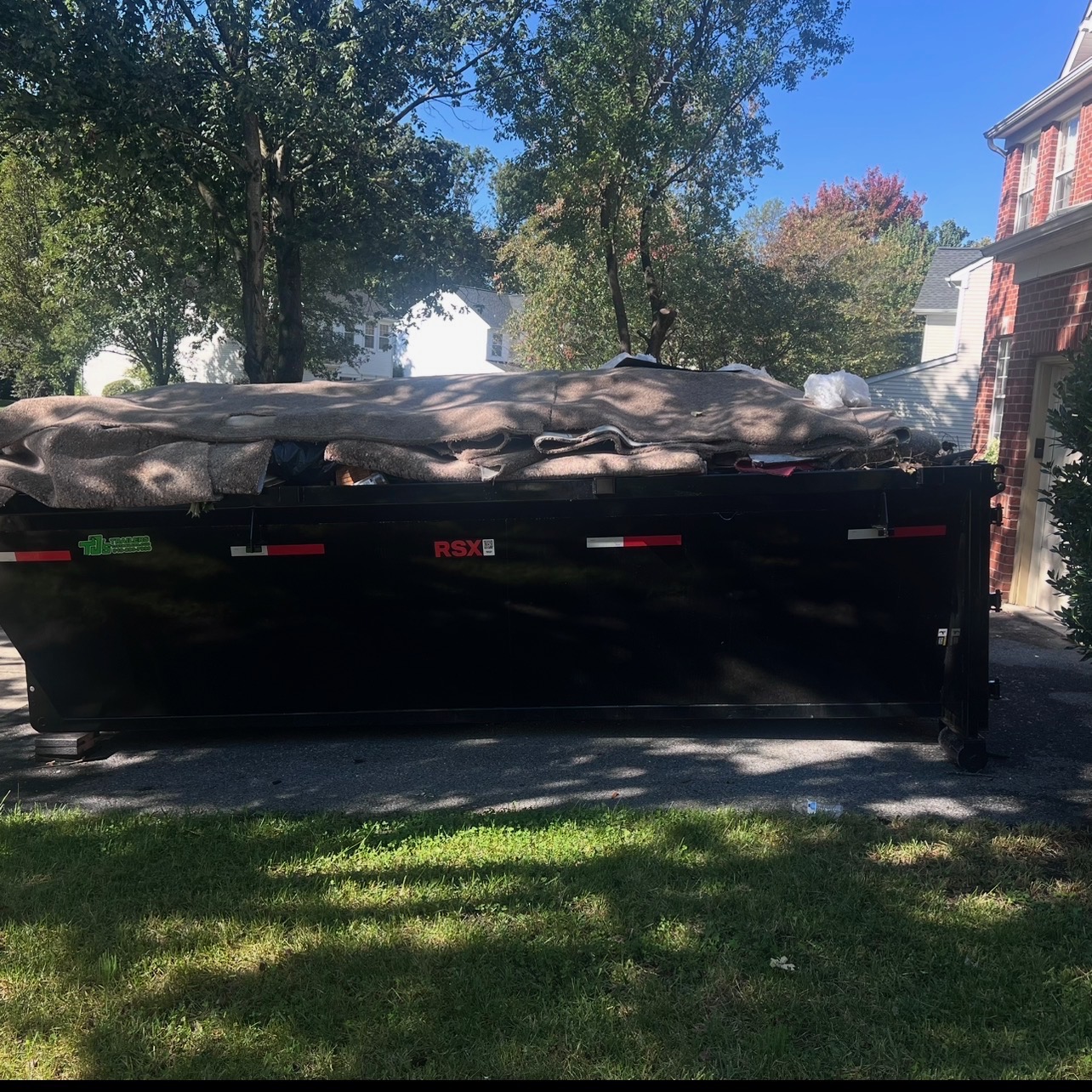 A Bin & Gon roll-off dumpster placed on a residential driveway in Prince George's County, MD